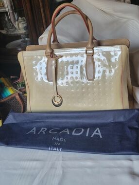 Arcadia Larger Glossy Cream Patent  Bag with Tan Accents and Gold Ring